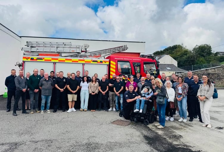 Bodmin firefighter Luke Hodge alongside his family, friends and colleagues from Cornwall Fire & Rescue Service and the Alstock Festival celebrate his award