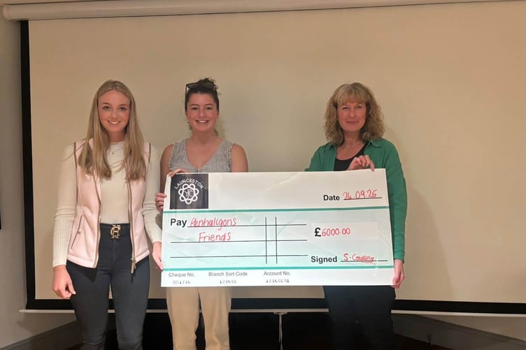 Members of Launceston YFC present a cheque for £6,000 to Penhaligon's Friends