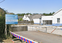 Plans to build housing at garage moves up a gear