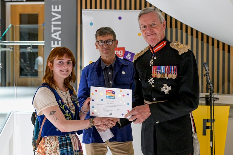 Philip Marsden and the Lord Lieutenant present Redruth's Roo Hargreaves with her certificate. Her impressive work explores personal experiences, mental health and the beauty of being different