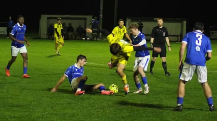 Both sides battle for possession at Broadclose Park.